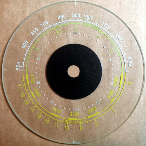 Dial photo taken on a brown/tan background to illustrate white print-glass is clear