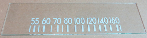 Dial image taken against tan/brown background to illustrate white scale print. Dial glass is clear other than scale print.