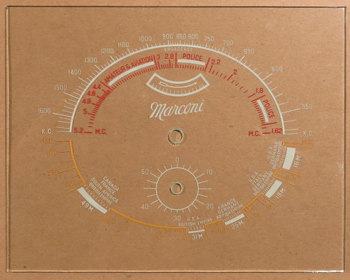 Dial image taken against a tan/brown background to better illustrate off-white portions of dial scale. Dial is clear other than dial scale print.