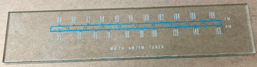 Dial photo taken with dial against light brown/tan background in order to illustrate dial print - glass is otherwise clear