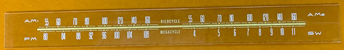 Dial image taken against a yellow-orange background to better illustrate the dial scale print. The dial glass is clear other than the scale print.