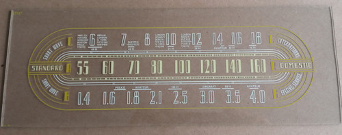 Dial image taken against a tan background to illustrate white print - dial glass is clear other than dial scale printing