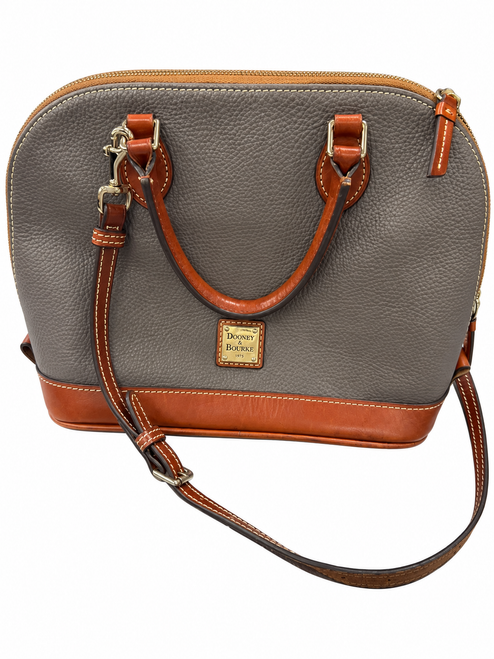 Vist Large View of Product Image Which is Gray pebbled Dooney & Bourke satchel with brown handles and trim, a gold-tone logo plaque, and an adjustable shoulder strap.
