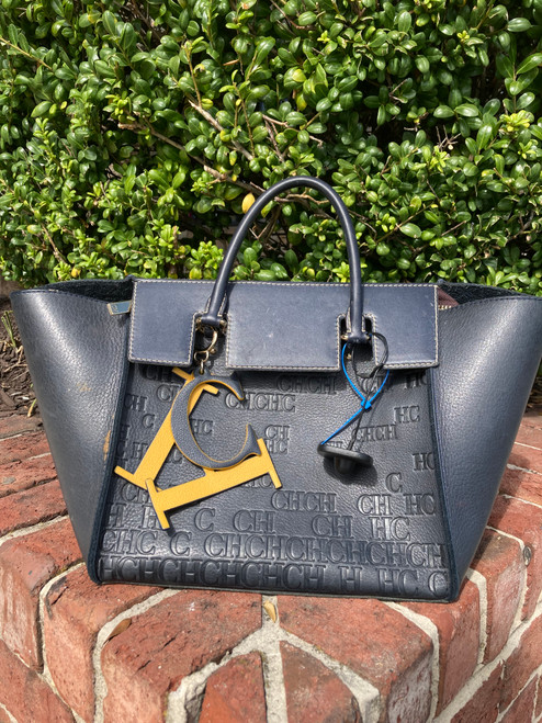 Vist Large View of Product Image Which is Used Carolina Herrera Handbag