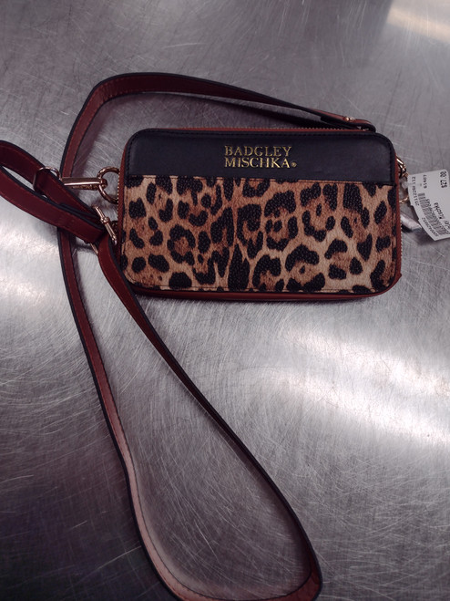 Vist Large View of Product Image Which is Used Badgley Mischka Wristlet