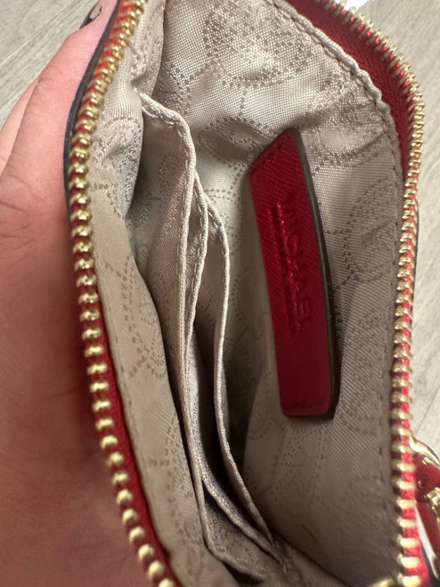 Vist Large View of Product Image Which is Used Michael Michael Kors Wristlet
