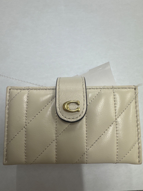 Vist Large View of Product Image Which is Used Cream Coach Leather Wristlet