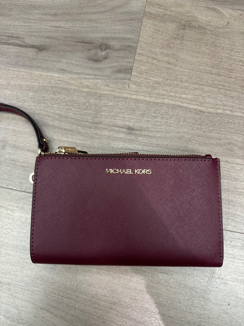 Vist Large View of Product Image Which is Used Michael Michael Kors Leather Wristlet