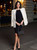Judith Leiber black rhinestone-embellished rectangular evening clutch with a foldover flap and dark gunmetal-tone chain strap. View 2