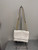 Used Cream Coach Klare Crossbody Bag with Signature Rivets 60137-S000106623 View 1