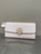 Used Tory Burch Britten pebbled leather envelope wallet in a delicate pink 60137-S000106626 View 1