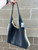 Brand new condition and includes an attachable/detachable wristlet.  View 1