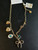 Used Jane Marie gold bow, and charms Necklace 60039-S000837566 View 1