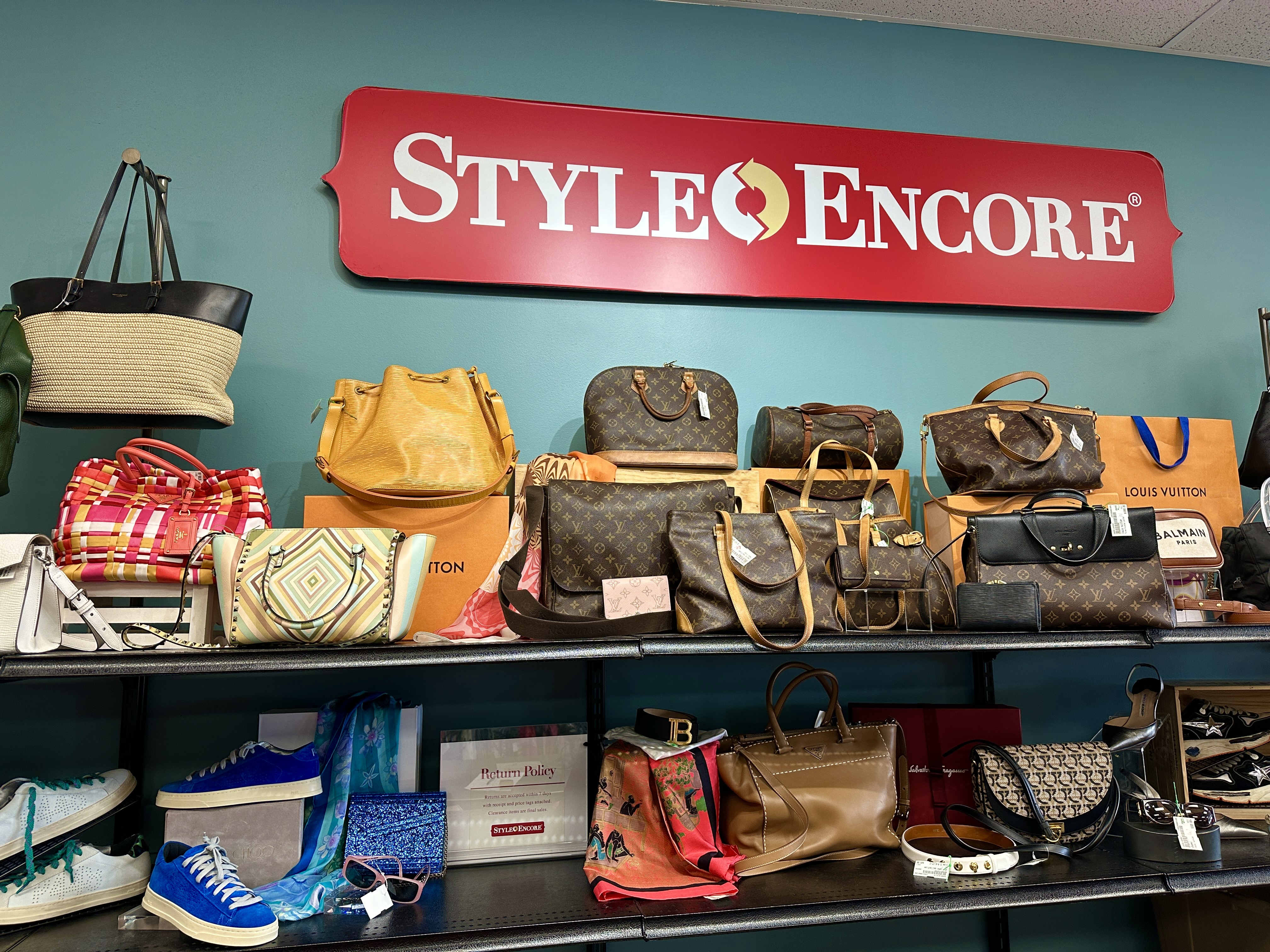 An image showing a lot of luxury handbags