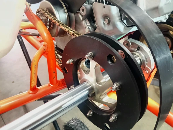 Rebuilt OTK Exprit kart rear axle assembly with new axle bearings and sprocket protectors