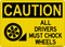 All Drivers Must Chock Wheels (Wheel and Block Left Symbol), Caution Sign