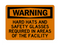 Hard Hats And Safety Glasses Required In Areas Of The Facility, Warning Sign