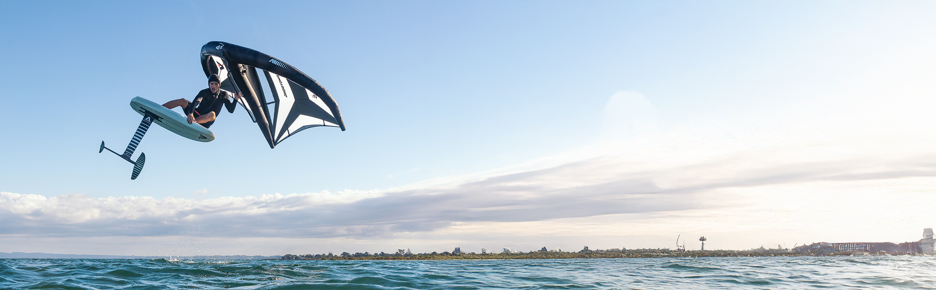 Beginner paddleboarding on a calm New Zealand lake