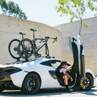 Talon - Single Bike Rack 2-PACK DELUXE Edition installed on the roof of a McLaren
