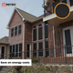 Large brick home fitted with 90% solar screens on all windows. UV-blocking mesh improves privacy and lowers interior heat gain while withstanding outdoor elements.