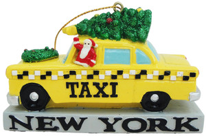 A X-mas or Christmas ornament with a yellow taxi with a Christmas three on top. A X-mas or Christmas ornament with a yellow taxi with a Christmas three on top.