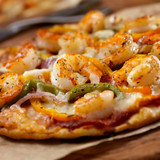 Pizza with shrimp topping .