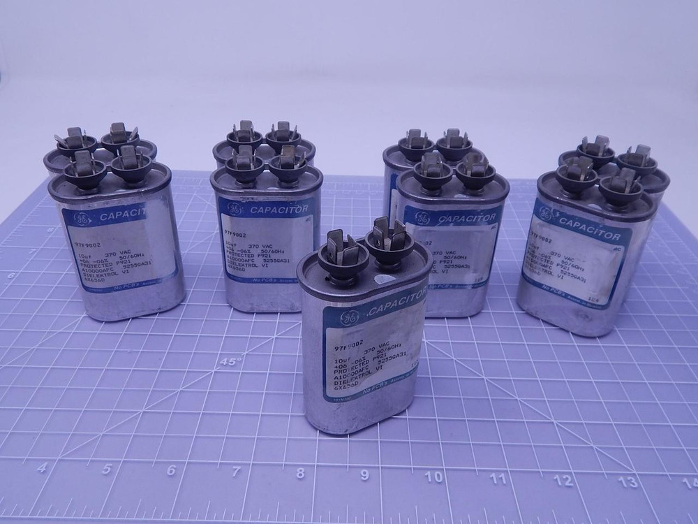 Lot of 9 GE 97F9002 Capacitors 10 uF 370 VAC + 06 - 06 % 50/60 Hz T110454 For Sale