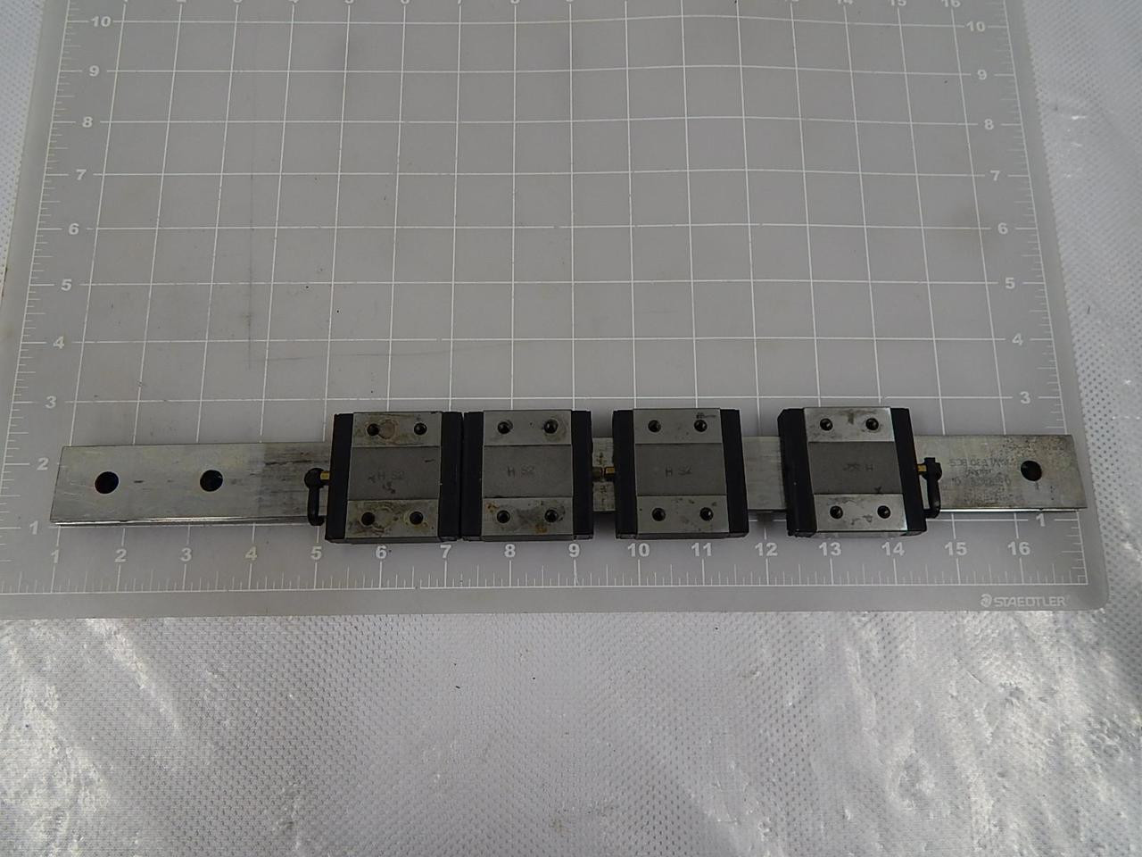 LOT OF 4 IKO LWLF30 BCS BEARINGS W/ 17 IN RAIL T86522