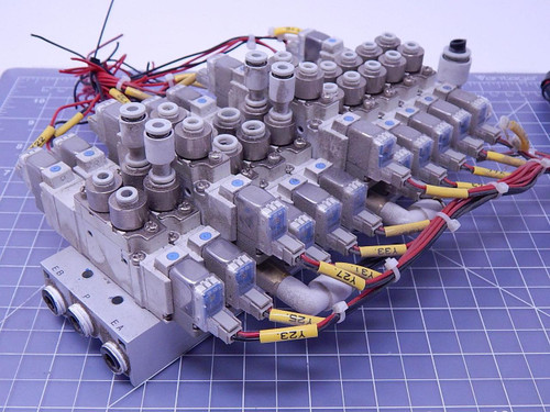 Lot of 12 SMC SY5320-5L0Z-C4 Pneumatic Valves w/ Manifold T106570 For Sale
