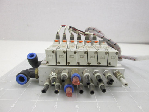 LOT OF 7 SMC SY5140-5M0ZE SOLENOID VALVES W/ MANIFOLD ASSEMBLY T59572