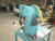 INDUSTRIAL PUNCH PRESS ON METAL WORK TABLE
