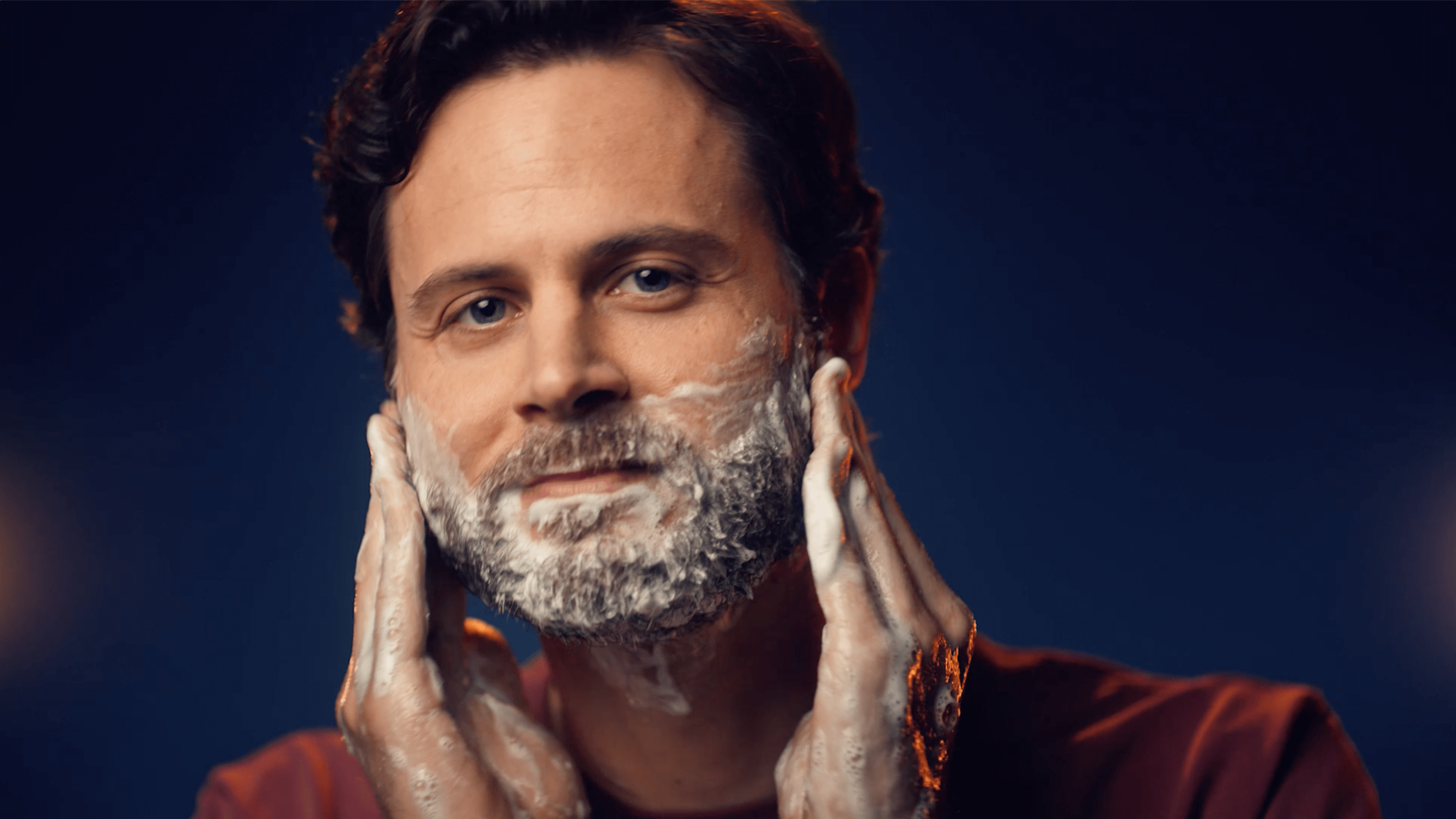 Dealing with beard dandruff by following a daily skincare routine.