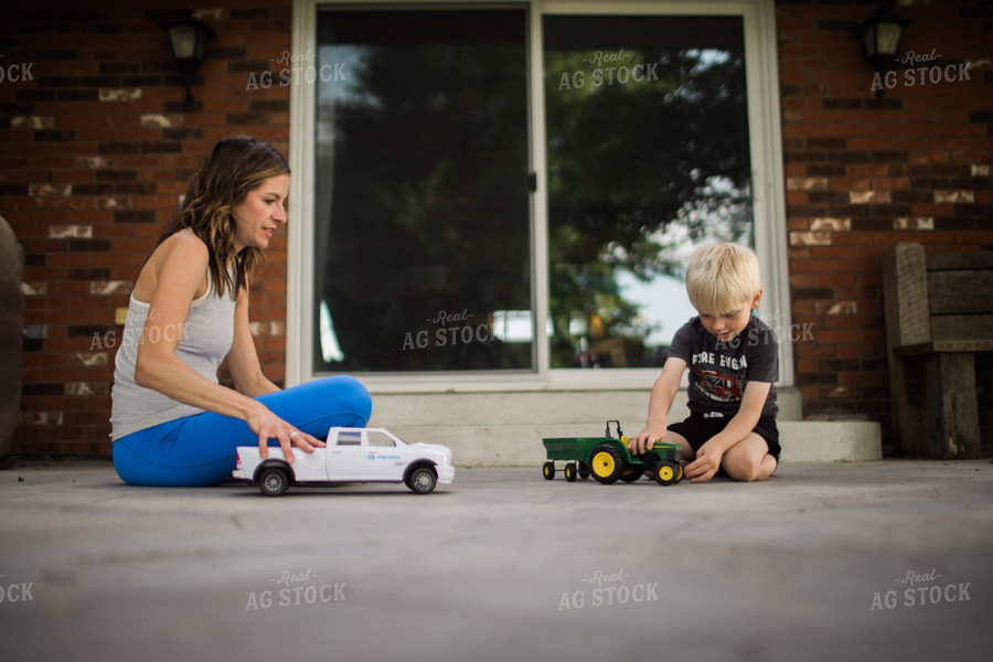 Woman and Farm Kid Playing with Toys 5949