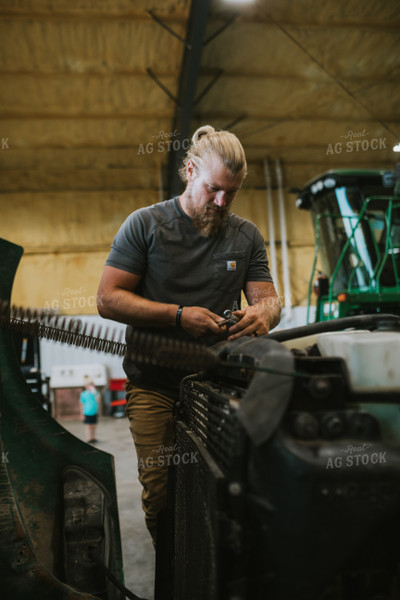 Farmer Working in Shed 6000