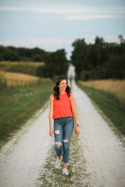 Female Farm Walking Down Road 6024