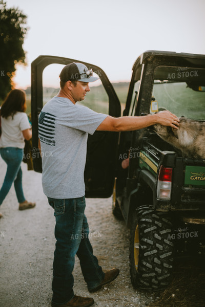 Farmer Petting Dog in Side by Side 6152