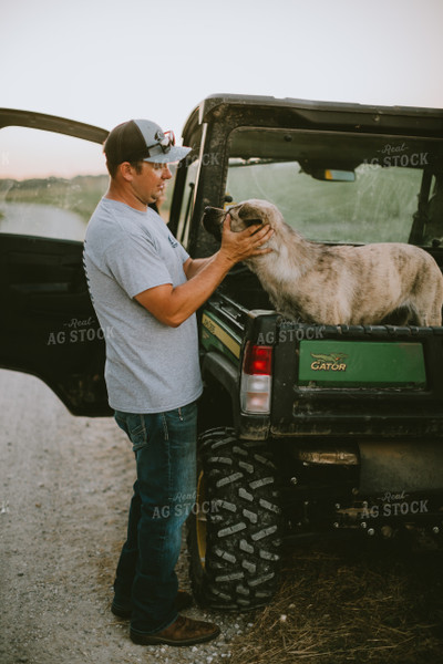 Farmer Petting Dog in Side by Side 6153