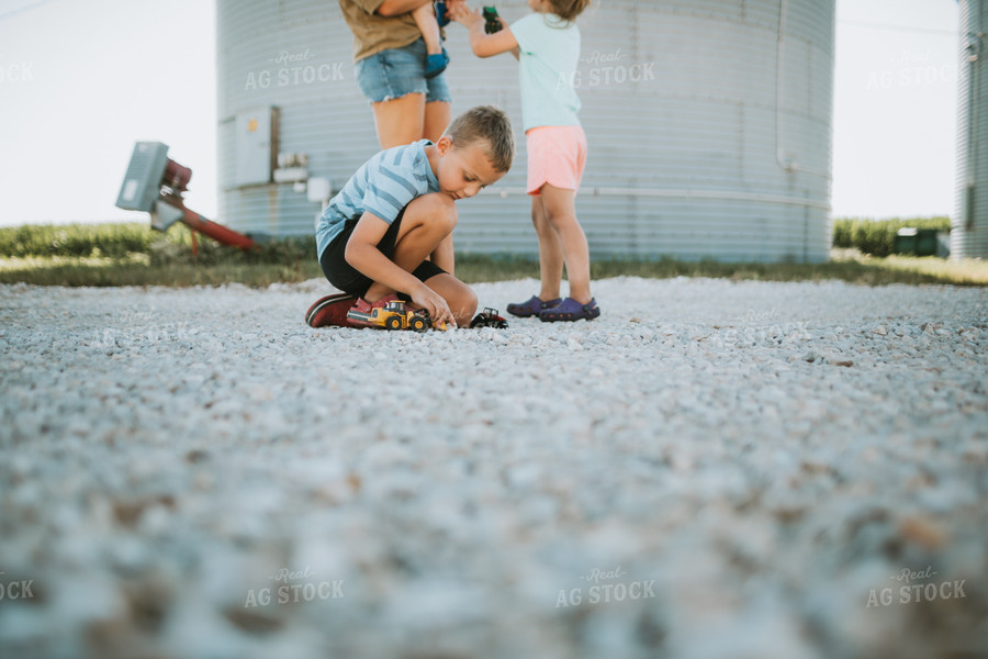 Farm Kids Playing with Toy Tractors 6166