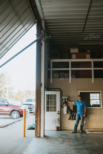 Farmer Opening Shop Door 6185