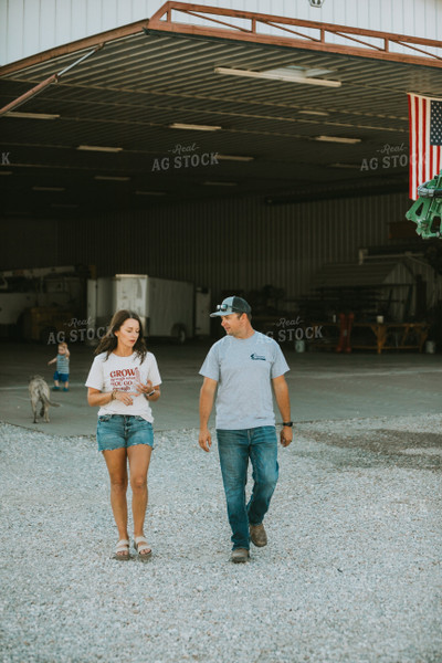 Farmer and Farm Wife Talking Outside Shop 6243