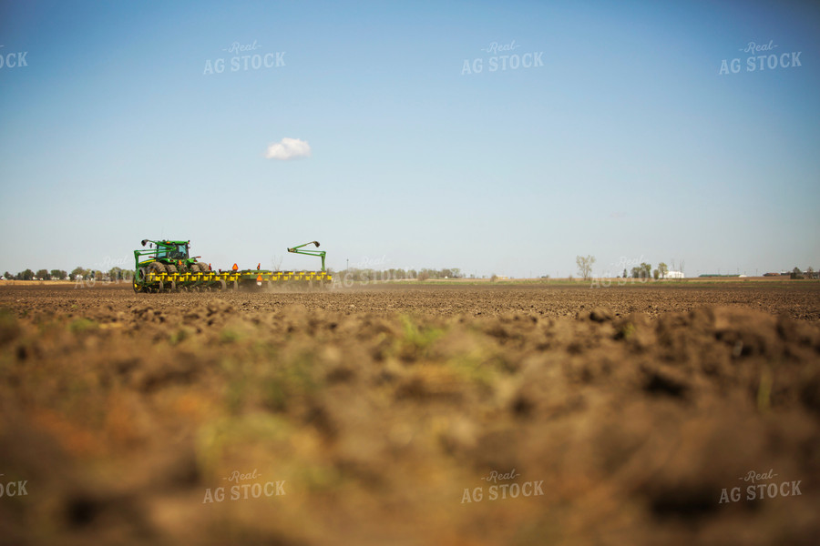 Tractor Pulling Planter in Field 6362