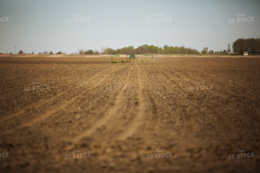 Tractor Pulling Planter in Field 6364