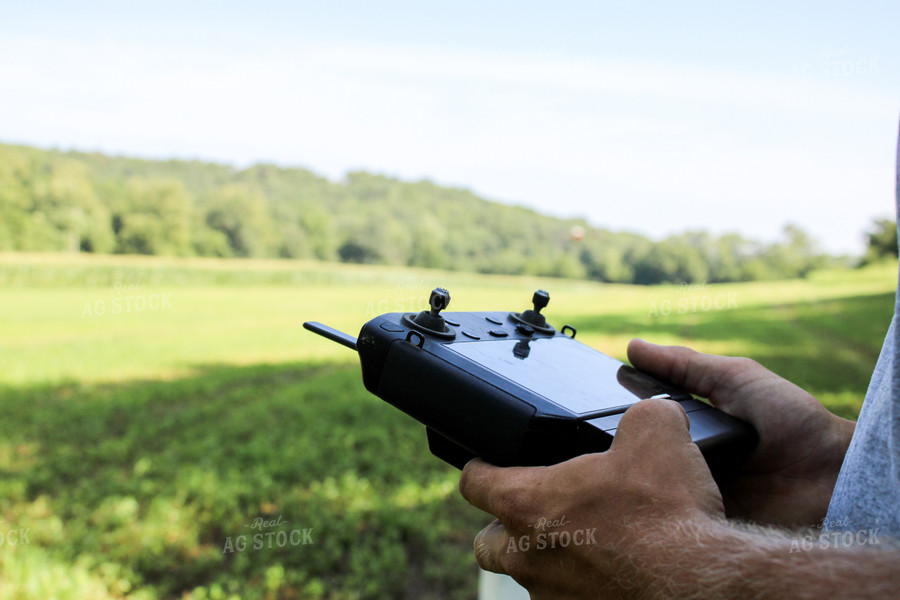 Farmer Holding Drone Remote 101011