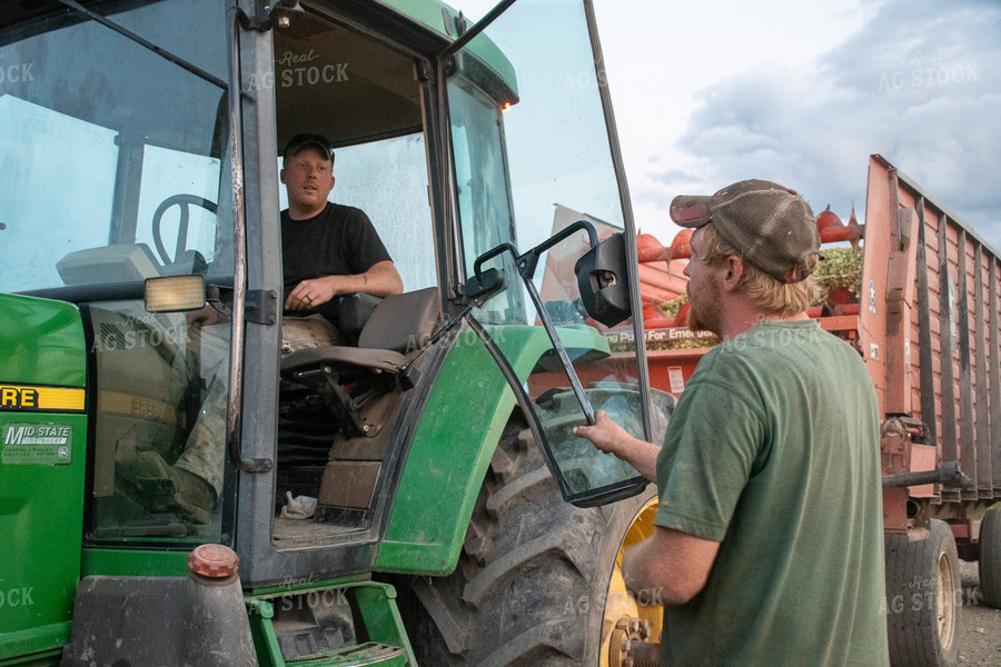 Farmer in Tractor Talking to Farmer 50262