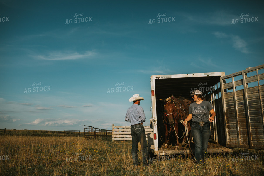 Ranchers in Pasture with Horse 6374