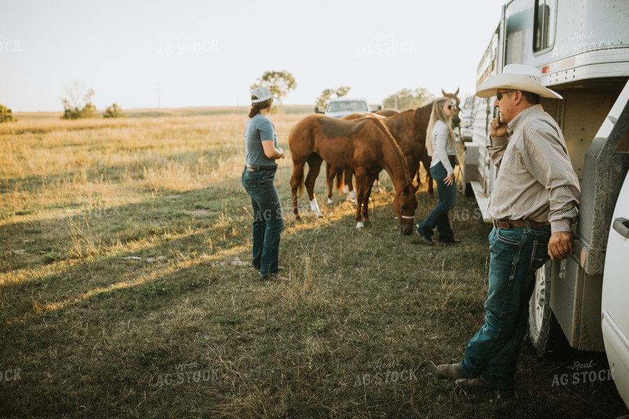 Ranchers and Horses Near Livestock Trailer 6426