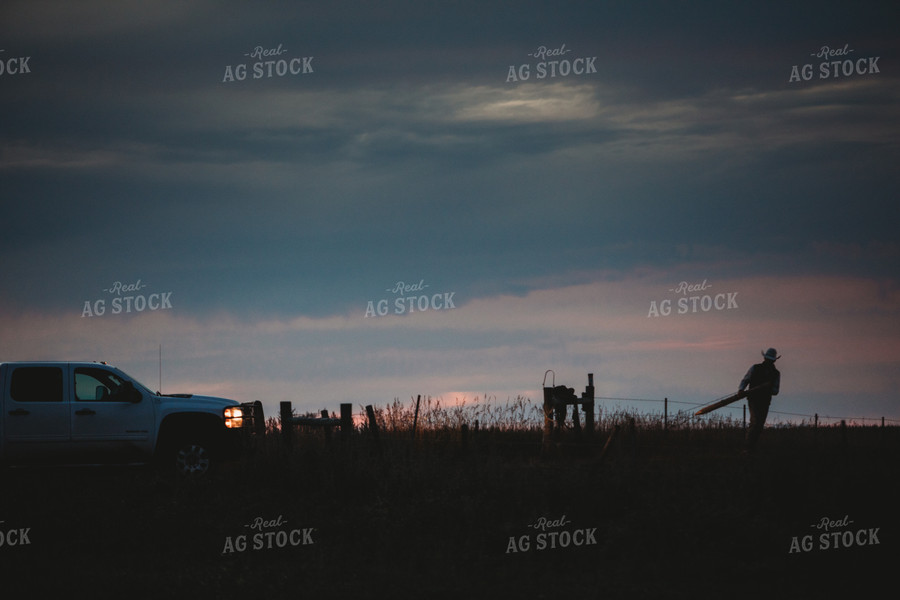 Rancher Working in Pasture at Dusk 6438