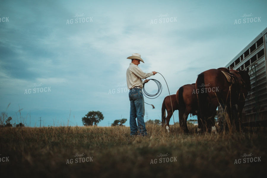 Rancher with Horses Near Livestock Trailer 6441