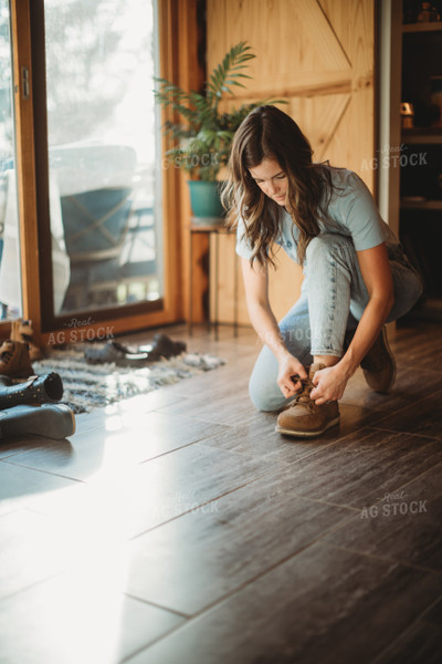 Farmer Putting on Shoes 6813