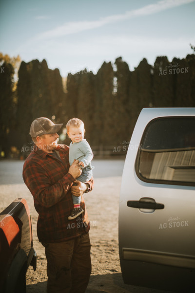 Farmer and Son in Yard 6823